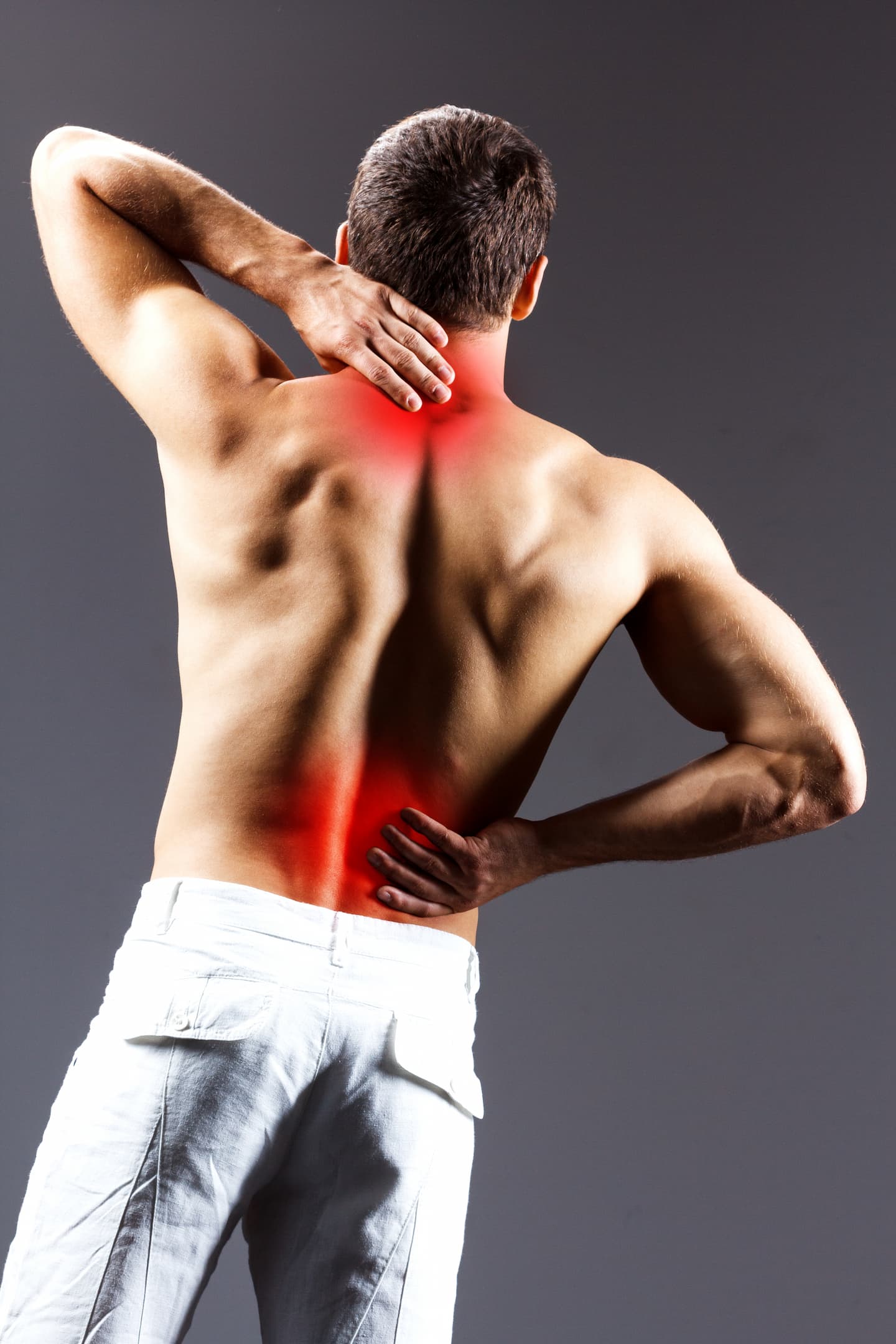 pain-relief-sport-bodybuilding-strength-people-concept-young-man-standing-black-background-1.jpg