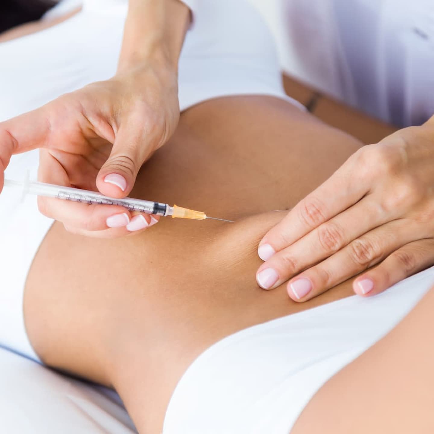 surgeon making injection into female body liposuction concept 1 1 7 facet joint injections facet joint injections,joint pain,joint pain relief,facet joint